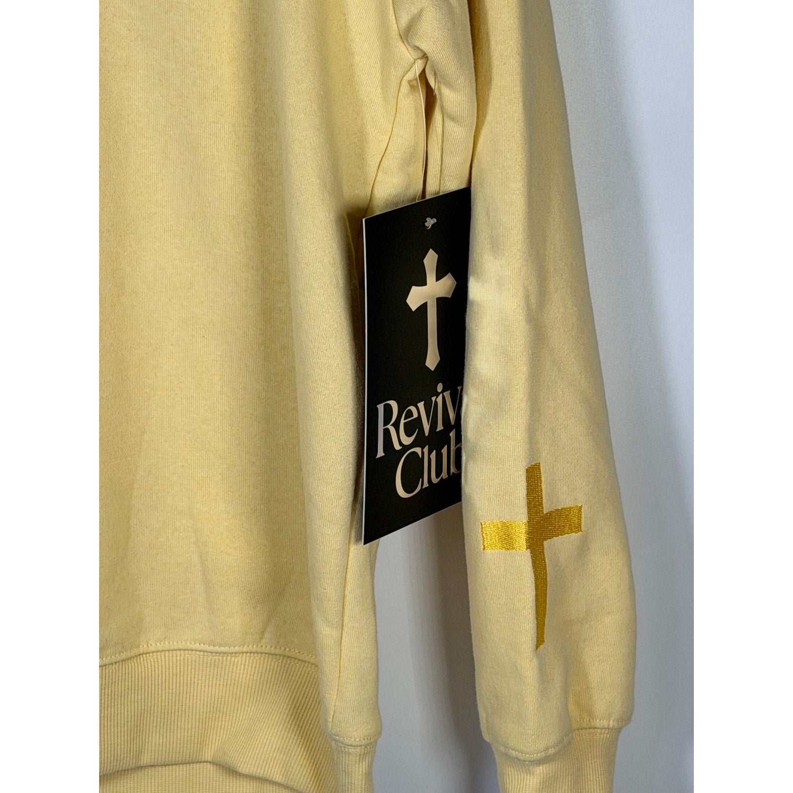 Yellow Revival Club Faith Cross crewneck sweatshirt in size S featuring a Christian cross design, casual and comfortable apparel.