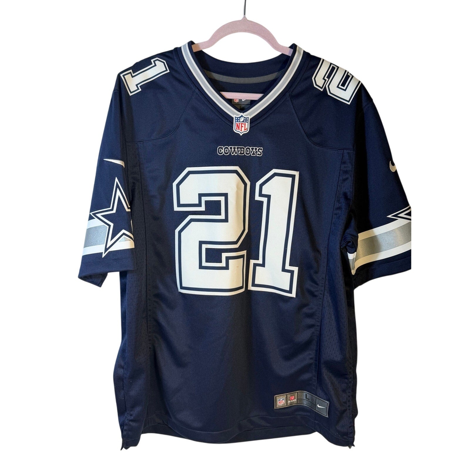 Nike Dallas Cowboys Ezekiel Elliott #21 NFL game jersey for men in large size, navy blue with team logo and player number.