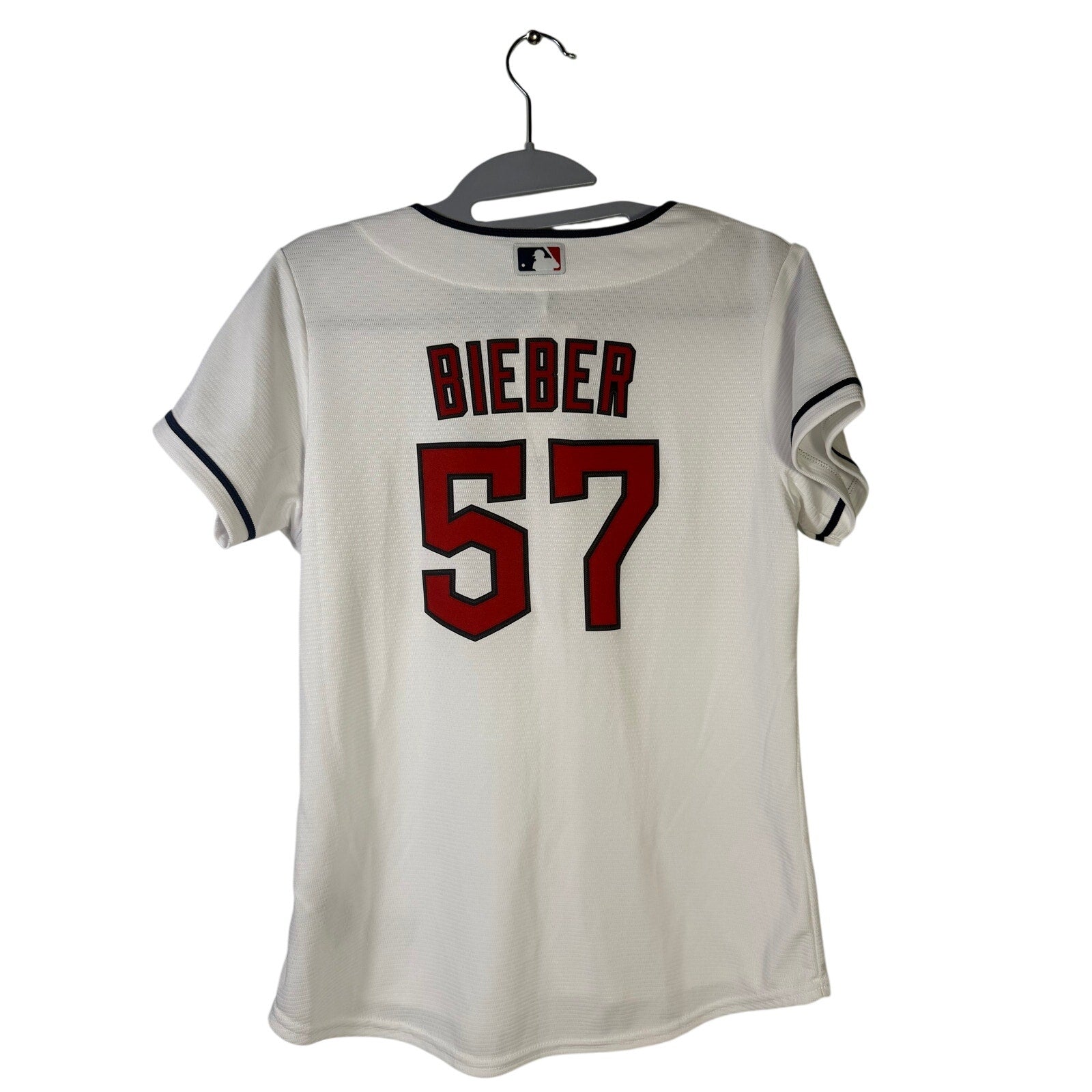 Nike Cleveland Guardians Shane Bieber #57 women's white jersey, size L, featuring team logo and player number.