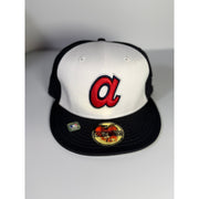 New Era Atlanta Braves 59FIFTY fitted cap in white and black, size 7 1/8, MLB team hat on a clean background.