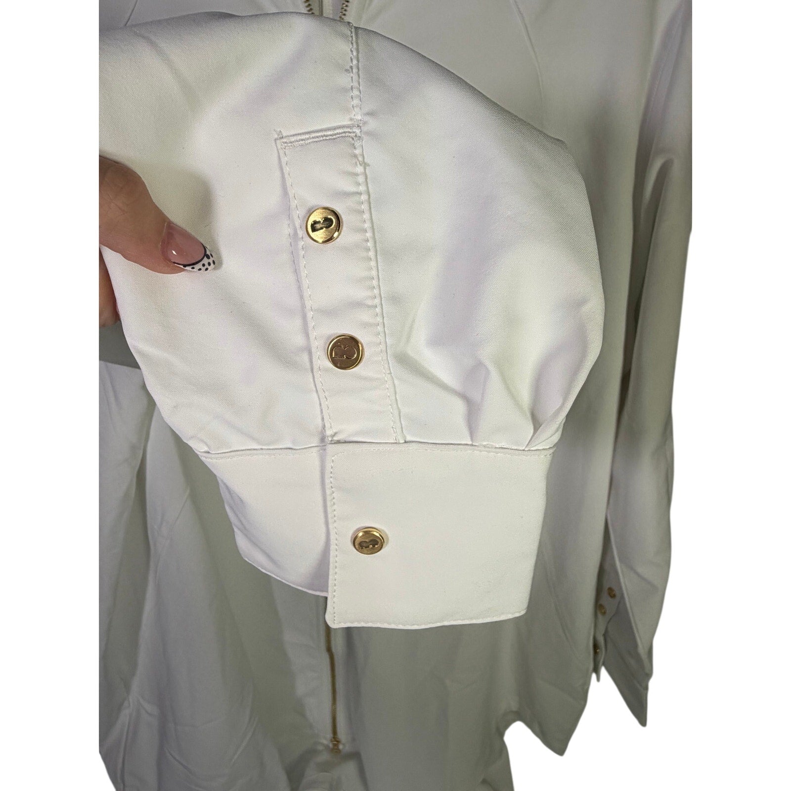 Nike women's long full zip cream jacket with logo, size XL, shown flat with front view and zipper detail.