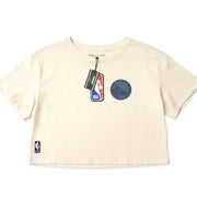 Women's cream NBA Golden State Warriors cropped T-shirt featuring team logo, displayed flat on a white background.