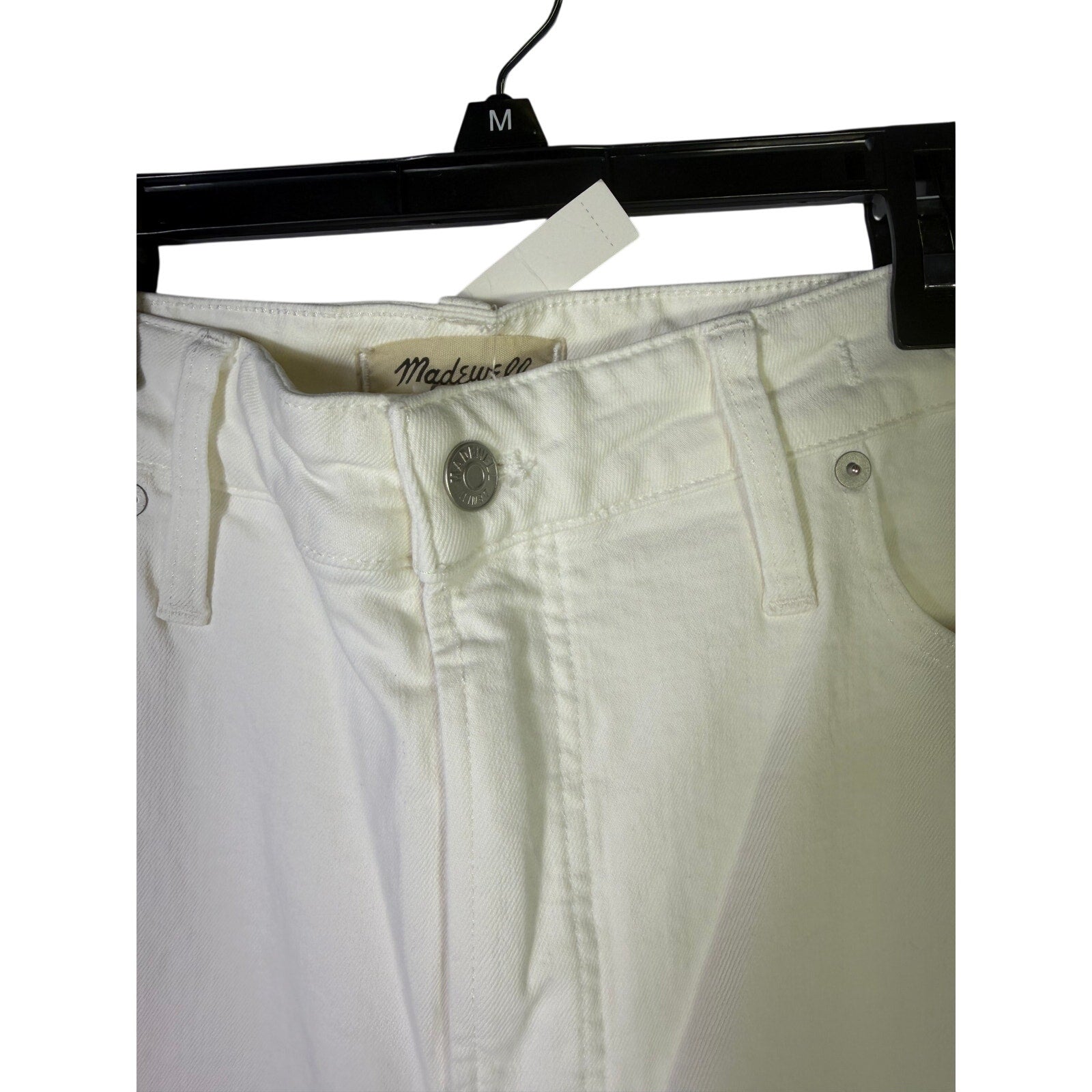 Madewell Curvy Perfect Vintage Jeans for women, size 33, white high-rise tapered fit, displayed on a hanger.