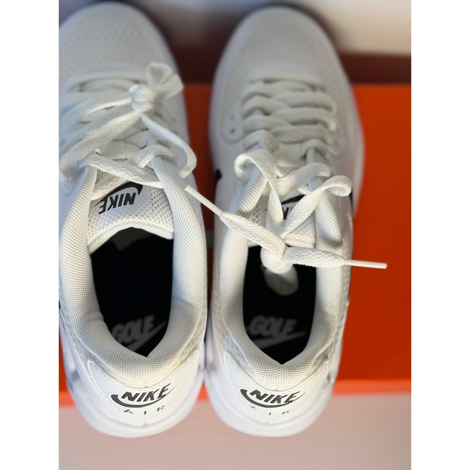 Nike Air Max 90 G golf shoes in white and black, men's size 4 and women's size 5.5, featuring Nike's sporty golf shoe design.
