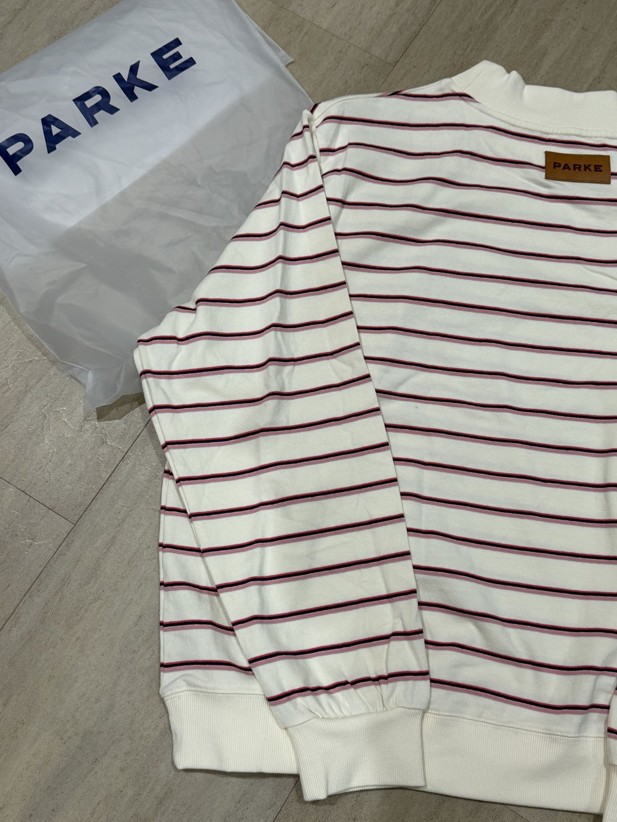 Parke women's XXL striped mock neck sweatshirt in cream pink navy with leather logo patch and ribbed cuffs.
