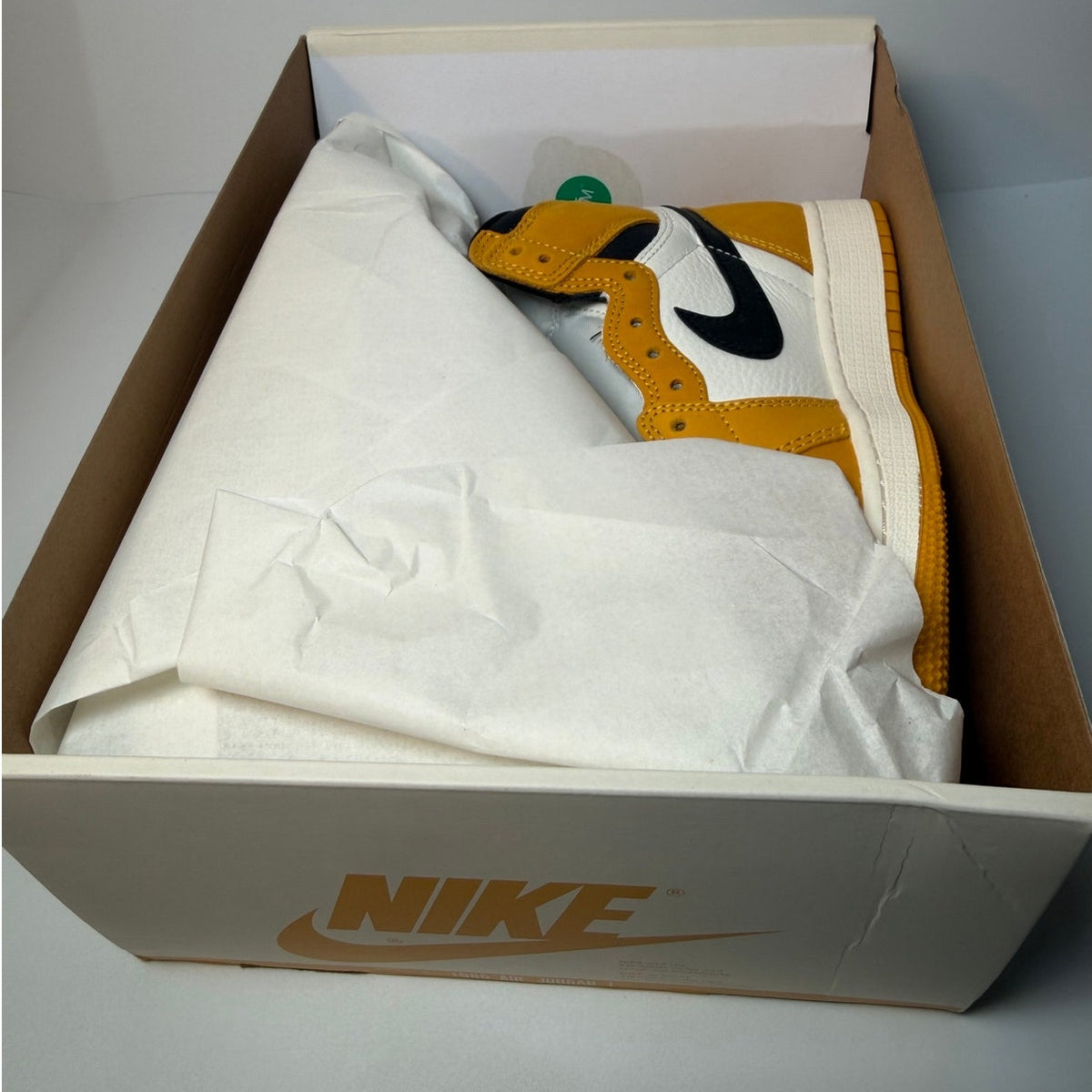 Nike Air Jordan 1 Retro High OG yellow ochre athletic shoes for grade school size 6Y, new in box, with yellow and black design.