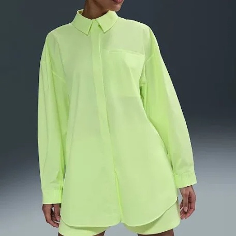 Nike 24.7 Women's New Venture oversized neon yellow long sleeve button-up shirt, casual women's tops with relaxed fit.