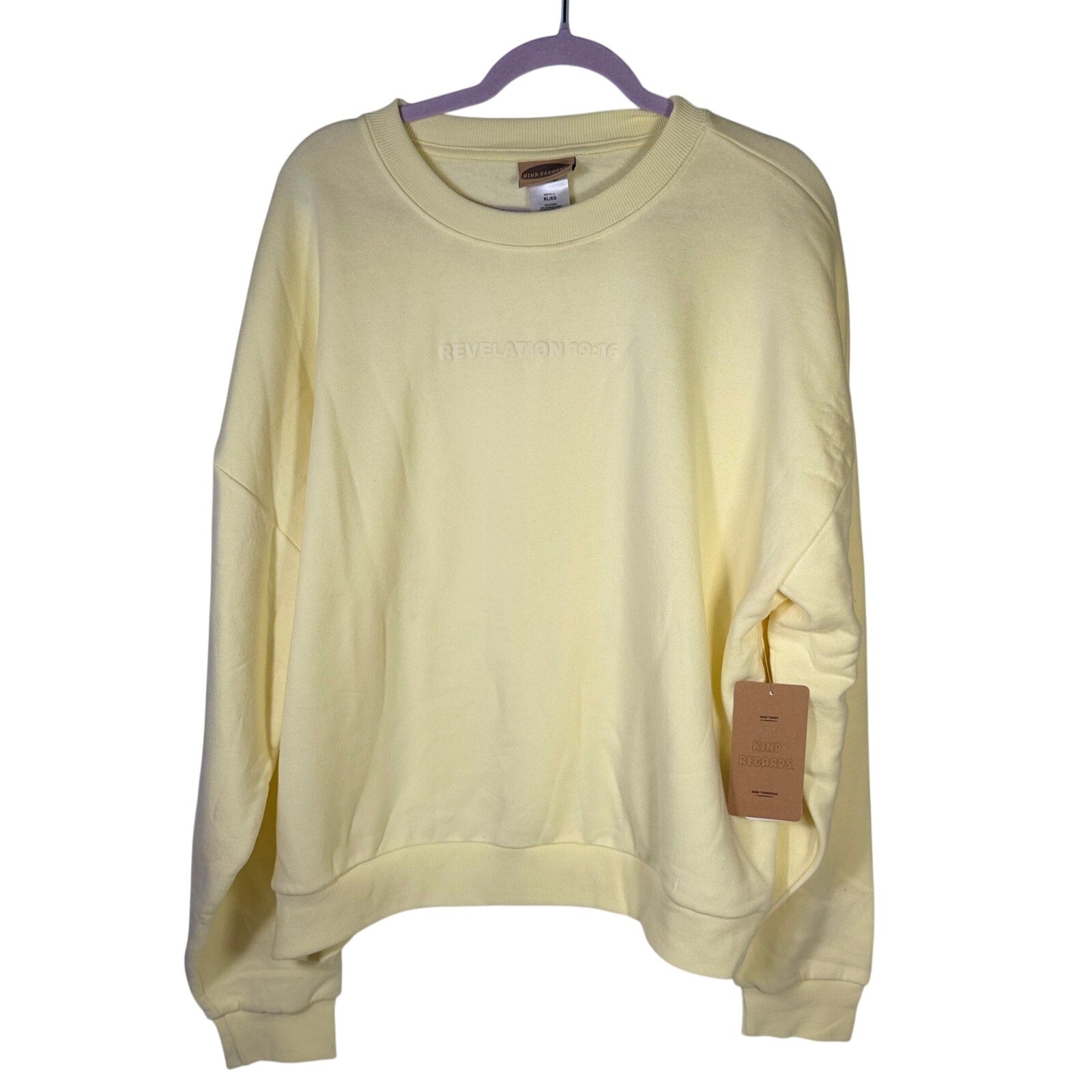 Yellow crewneck sweatshirt by Kind Regards featuring Revelation 19:16 Jesus Is King design, available in XL size.