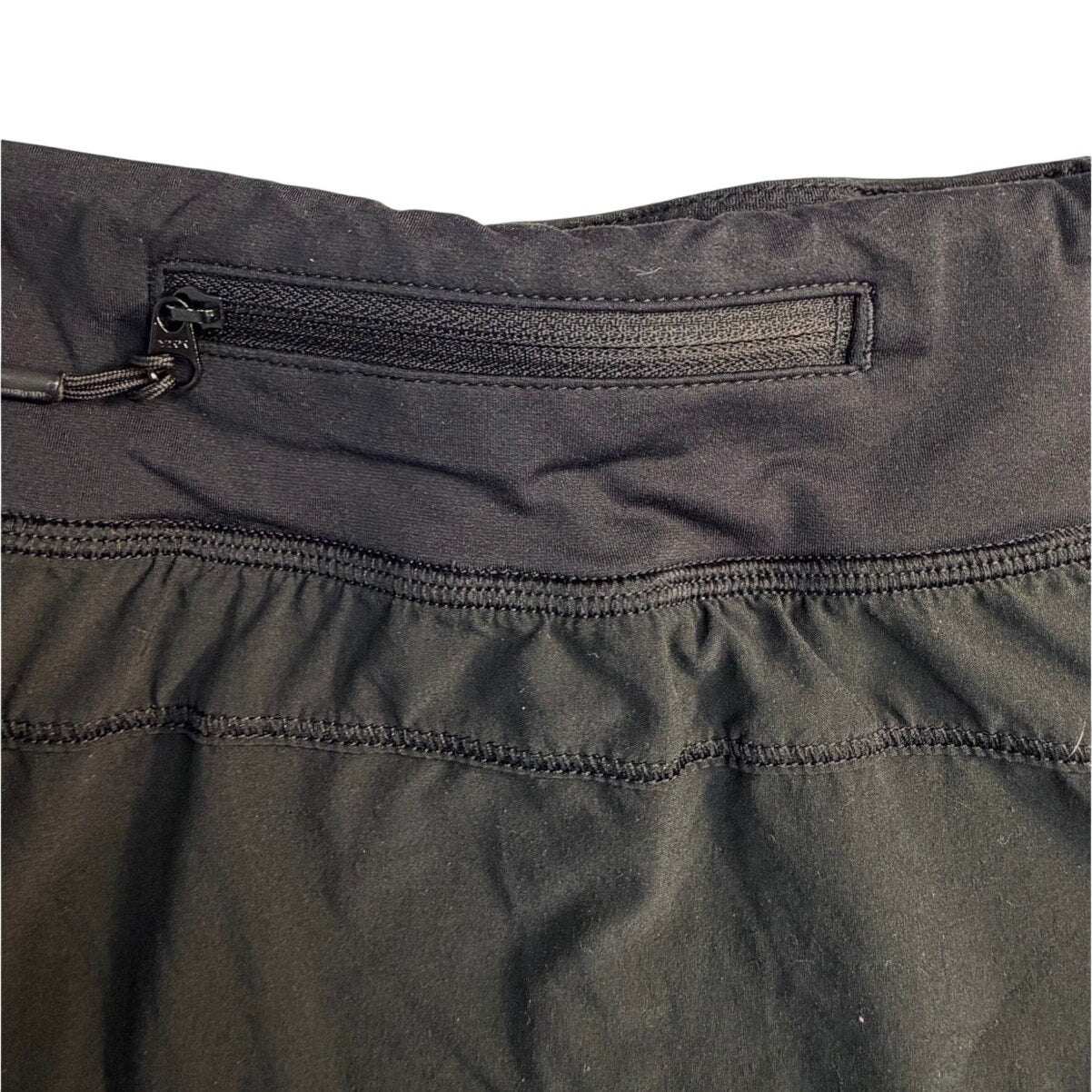 Lululemon women's black athletic skirt with built-in layers, size 8, designed for active wear and comfort.