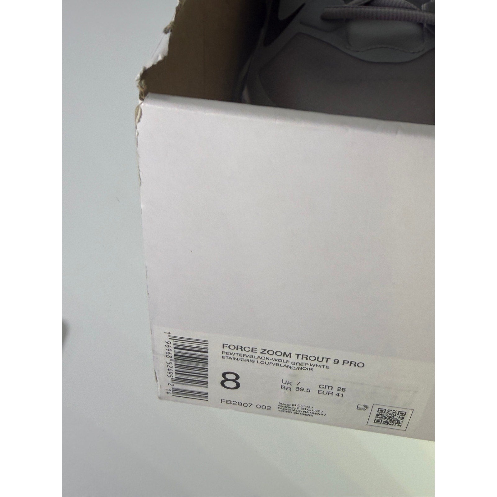 Nike Force Zoom Trout 9 Pro men's baseball cleats in grey, athletic shoes with supportive design and cleat studs for grip.