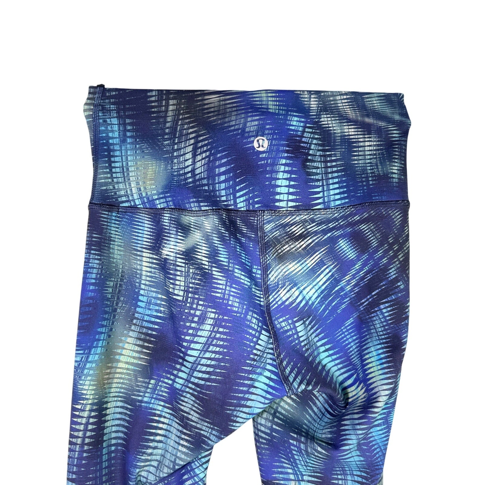 Lululemon women's high-rise full-length leggings in blue abstract print, size 4, with a fitted stretch design.