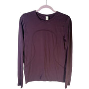 Lululemon Women’s Swiftly Tech long-sleeve athletic shirt in purple, size 6, made of breathable performance fabric.