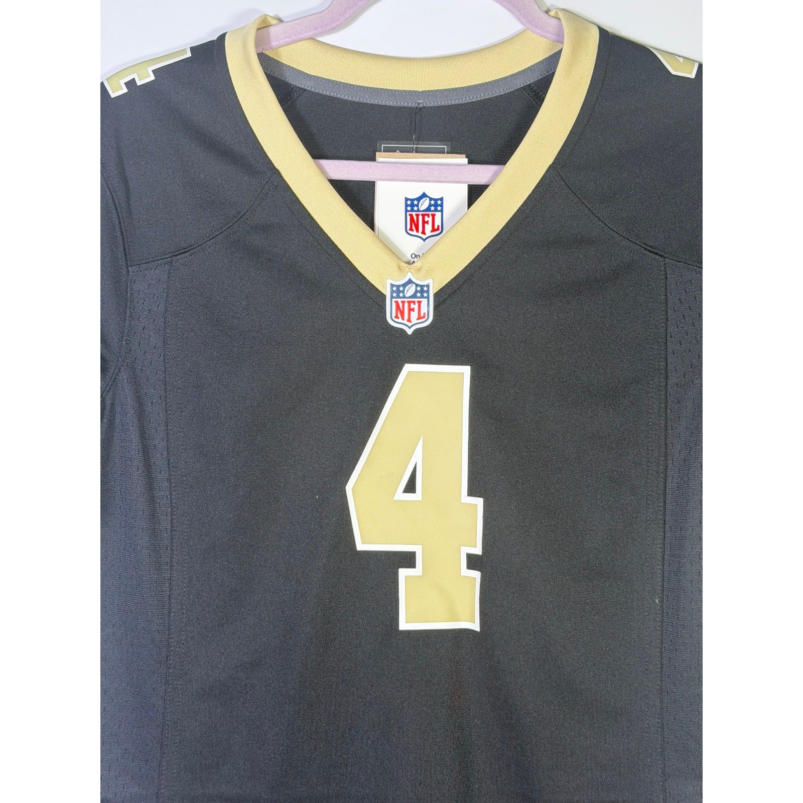 Nike Women’s New Orleans Saints Derek Carr #4 game jersey in black, featuring team logo and player number, size M.