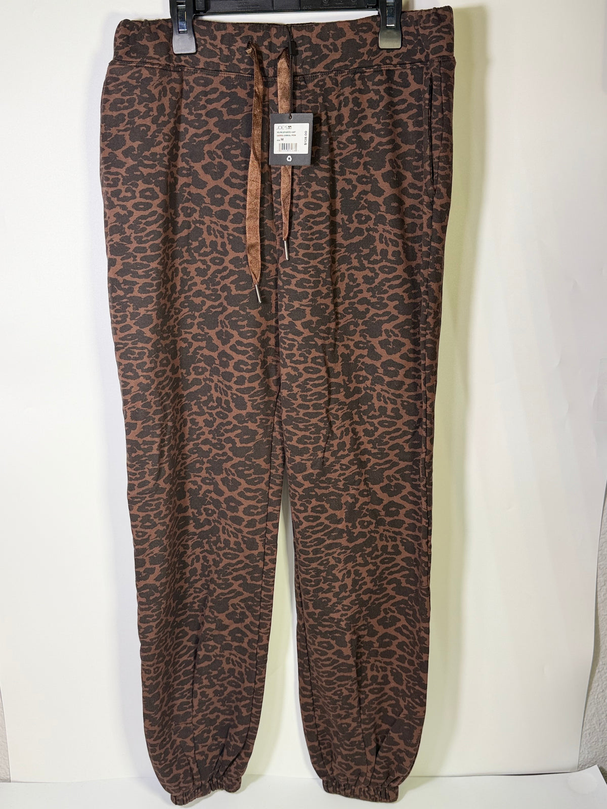 Joe's Sierra animal print jogger pants in brown, size M, featuring a stylish, comfortable fit and animal-inspired pattern.