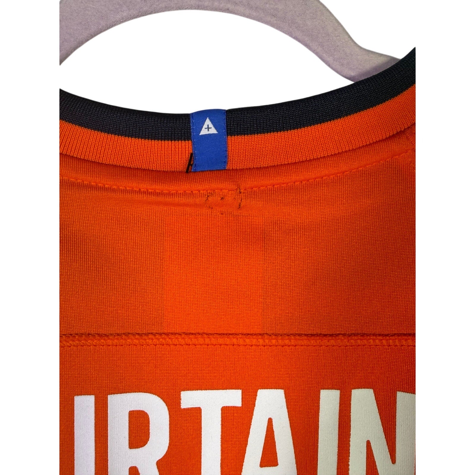 Nike youth Denver Broncos Patrick Surtain II #2 game jersey in orange, size large, with team logo and player details visible.