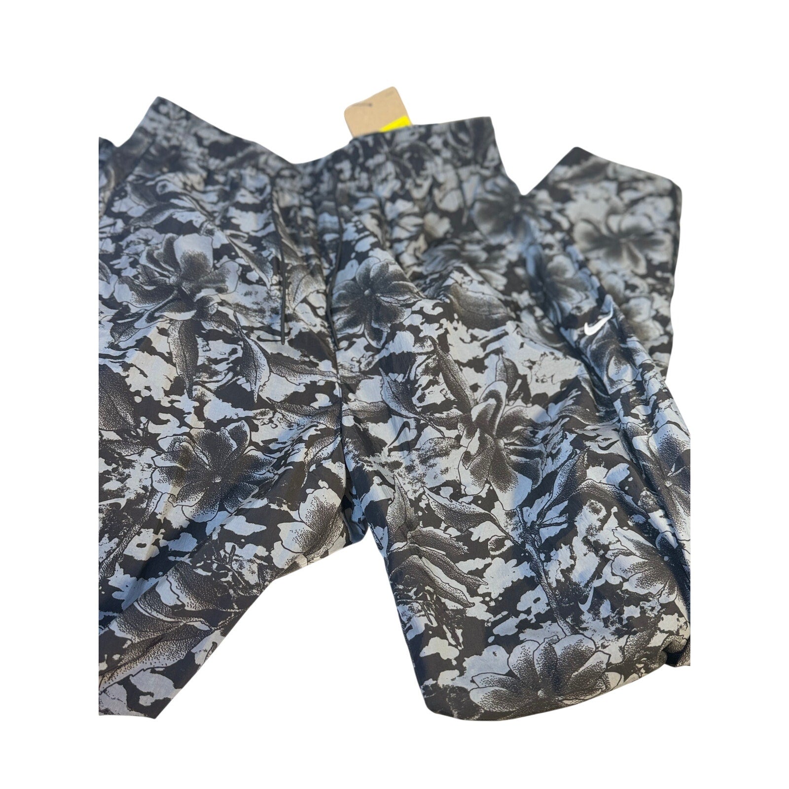 Nike Dri-FIT ADV women's running shorts in black and gray floral print, size small, with lightweight, breathable fabric.
