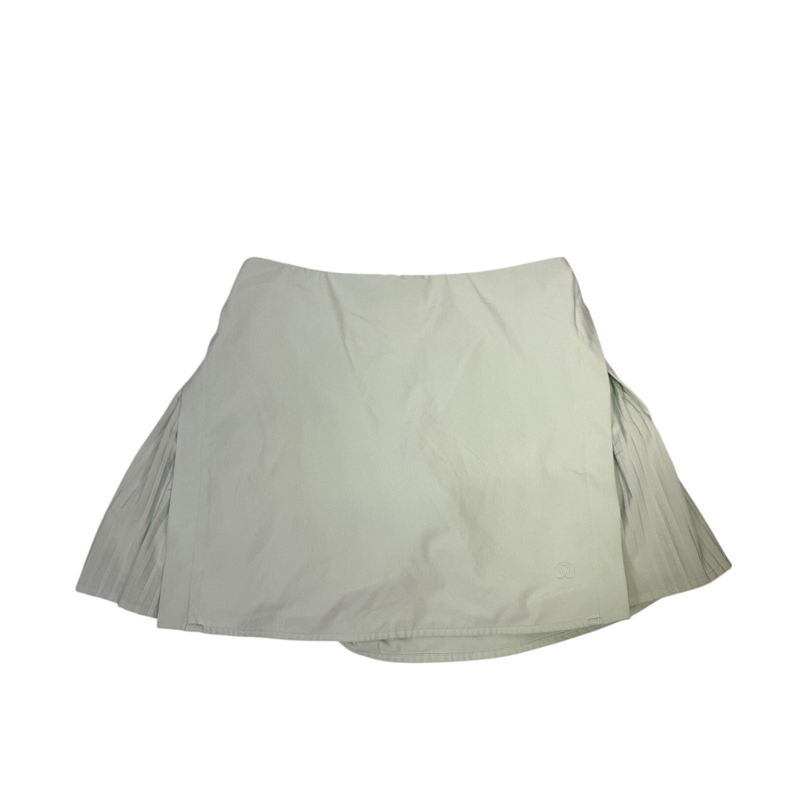 Lululemon women’s light mint pleated tennis skort with built-in shorts, size 6, featuring a comfortable athletic design.