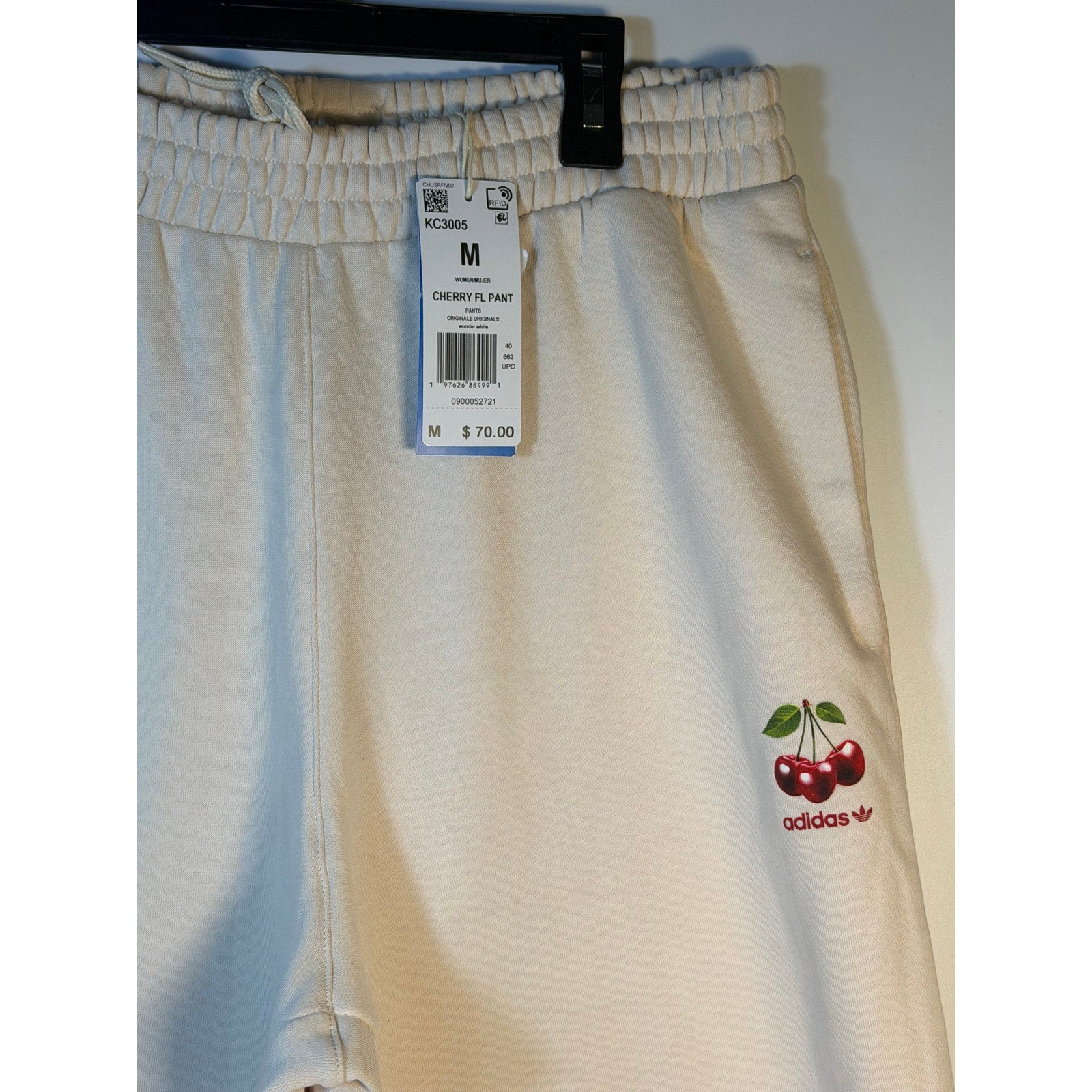 Adidas Originals Cherry FL Pant women's wide-leg sweatpants in Wonder White, medium size, soft fabric, relaxed fit.