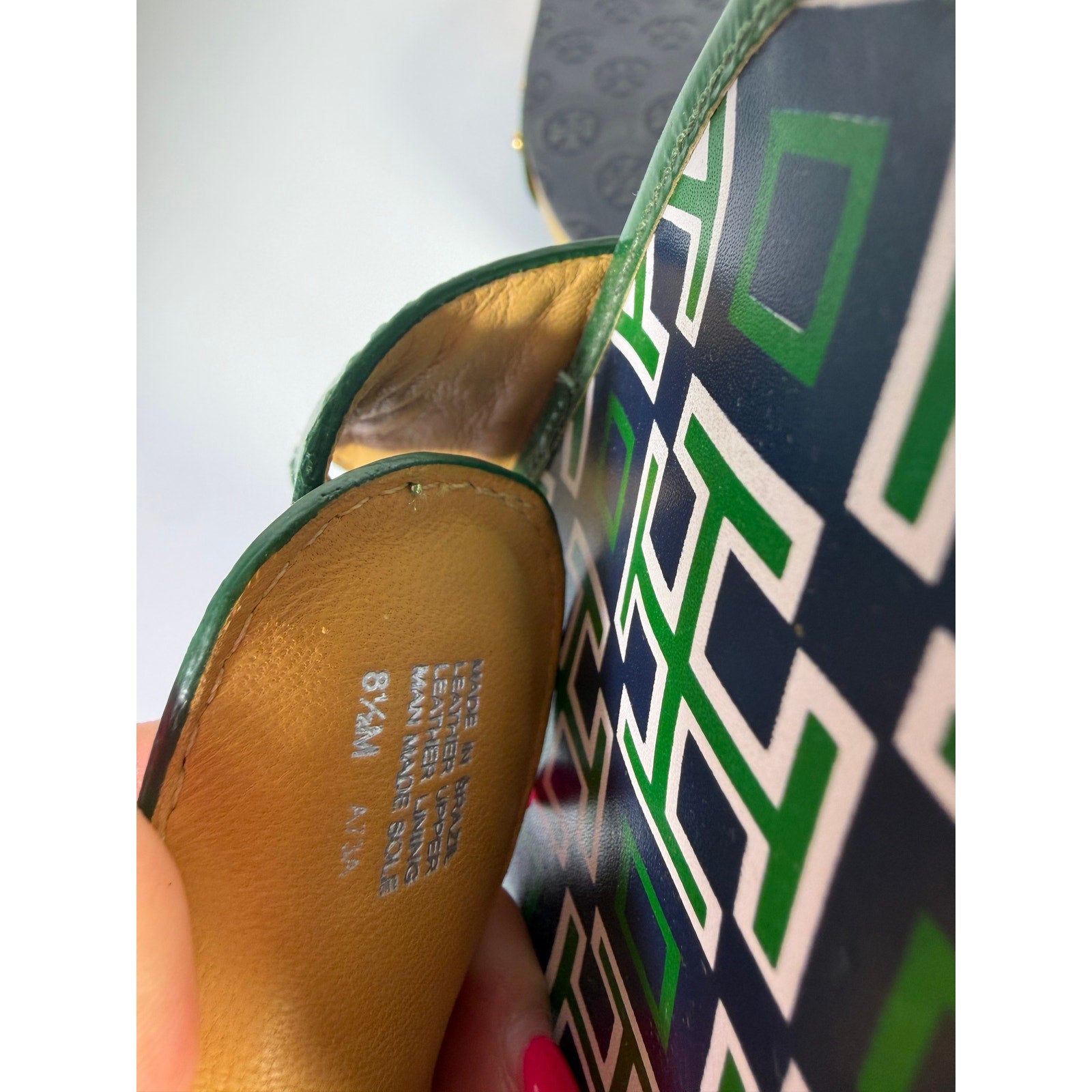 Green patent leather Tory Burch slide sandals for women, size 8.5, with a sleek design and made in Brazil.