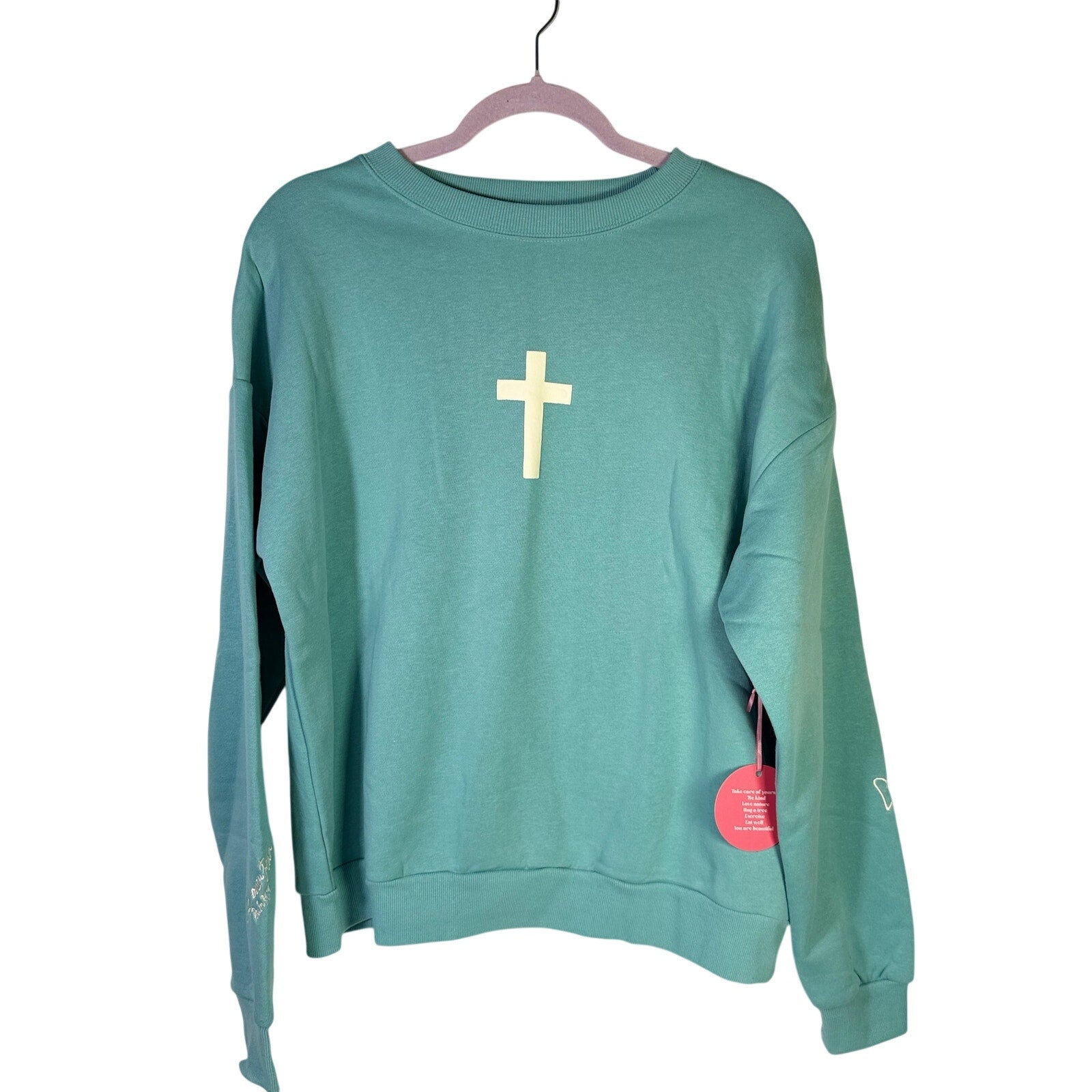 Seventh & Sunset Faith Over Fear green Christian crewneck sweatshirt, medium size, soft fabric, front graphic design.