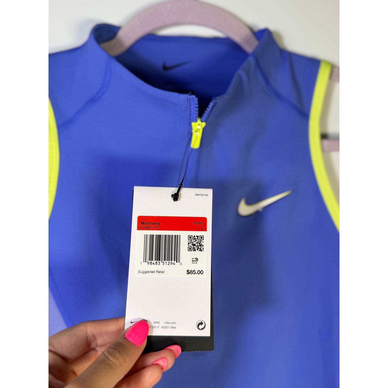 Nike women's blue and yellow quarter-zip cropped tank top, size L, featuring a sporty design and breathable fabric.