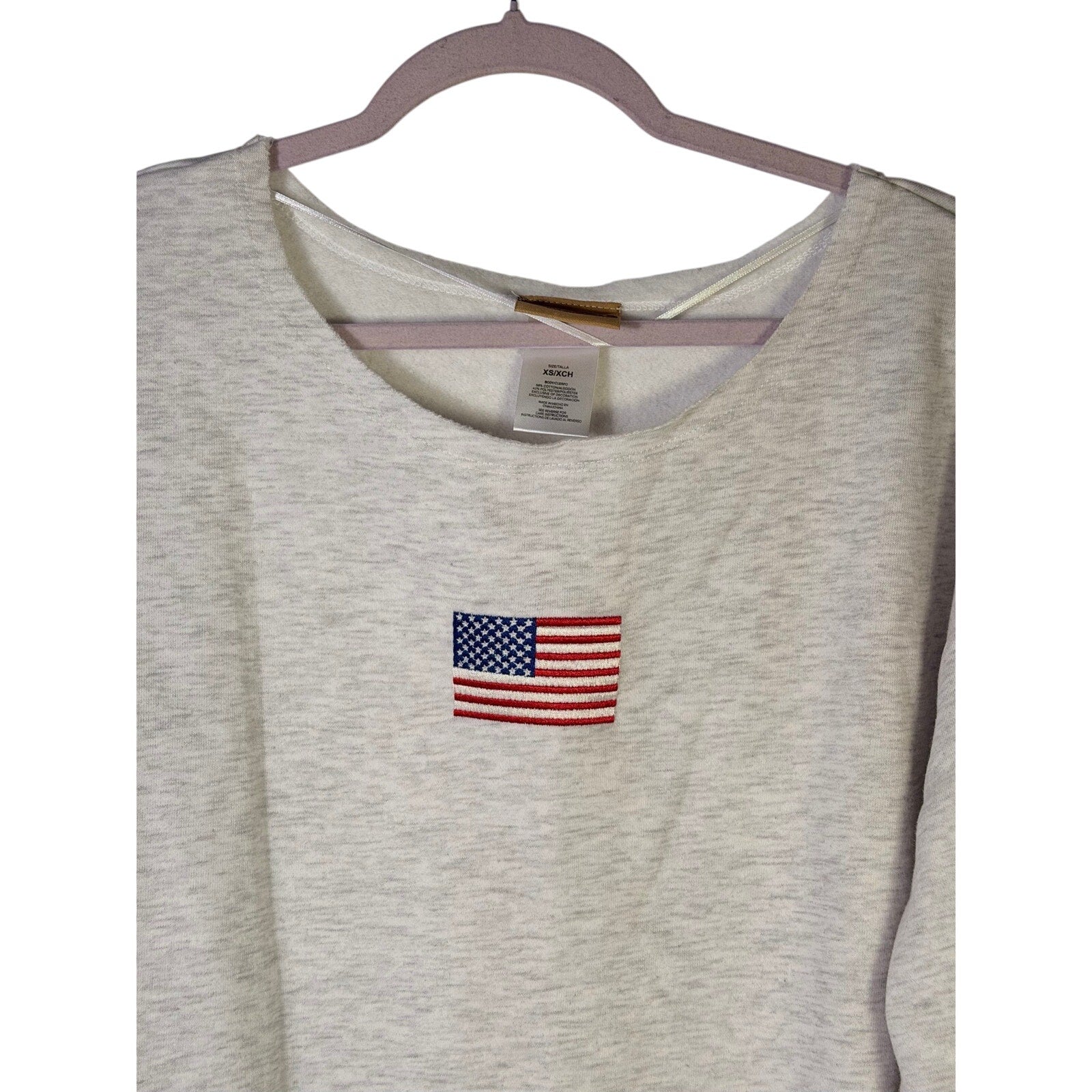 Women’s American flag embroidered crewneck sweatshirt by Kind Regard, size XS, with patriotic flag design on soft cotton fabric.