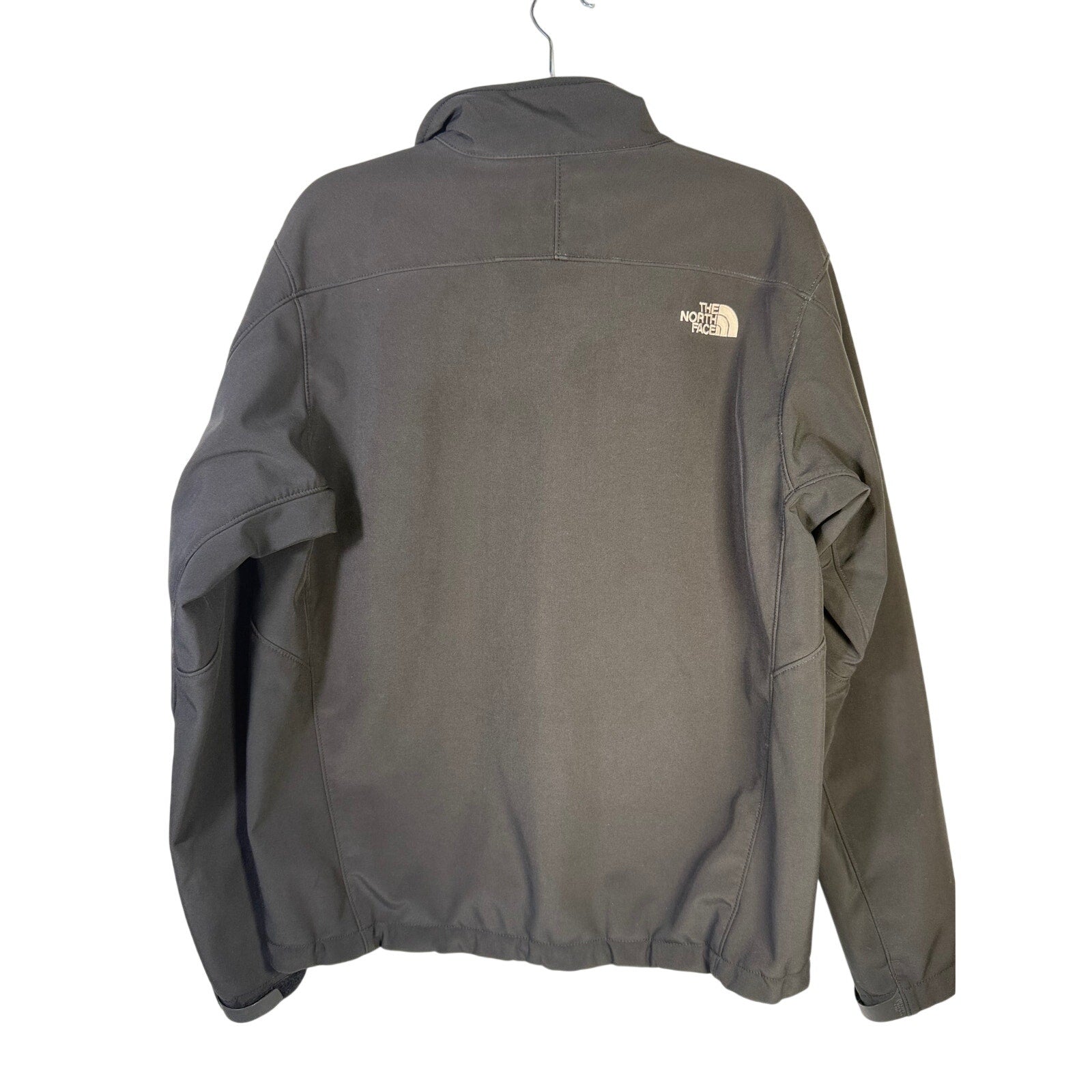 Black The North Face men's softshell jacket with full zip and fleece lining, showing the jacket's front view and logo.
