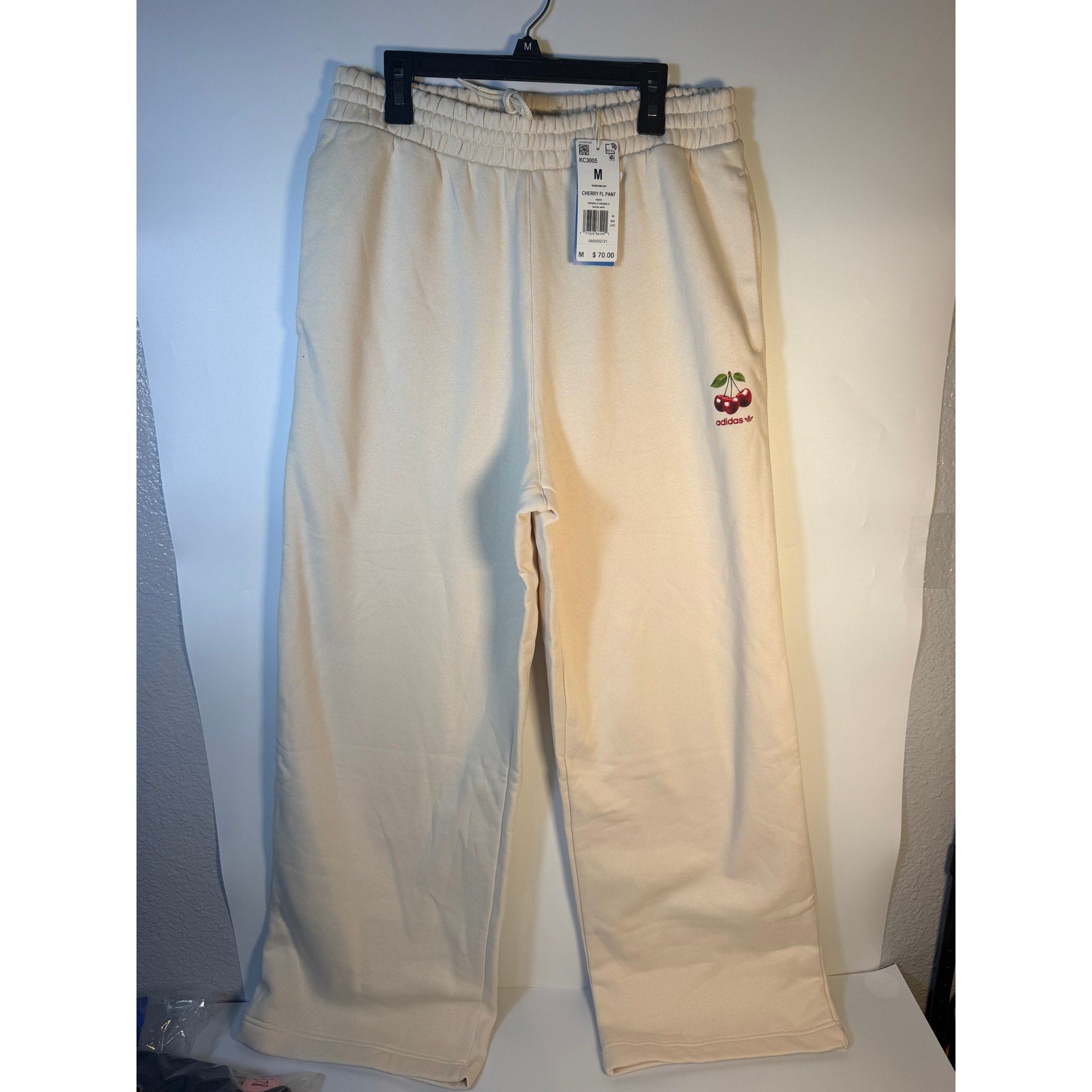 Women's Adidas Originals Cherry FL Pant sweatpants in Wonder White with a wide-leg fit and relaxed style.