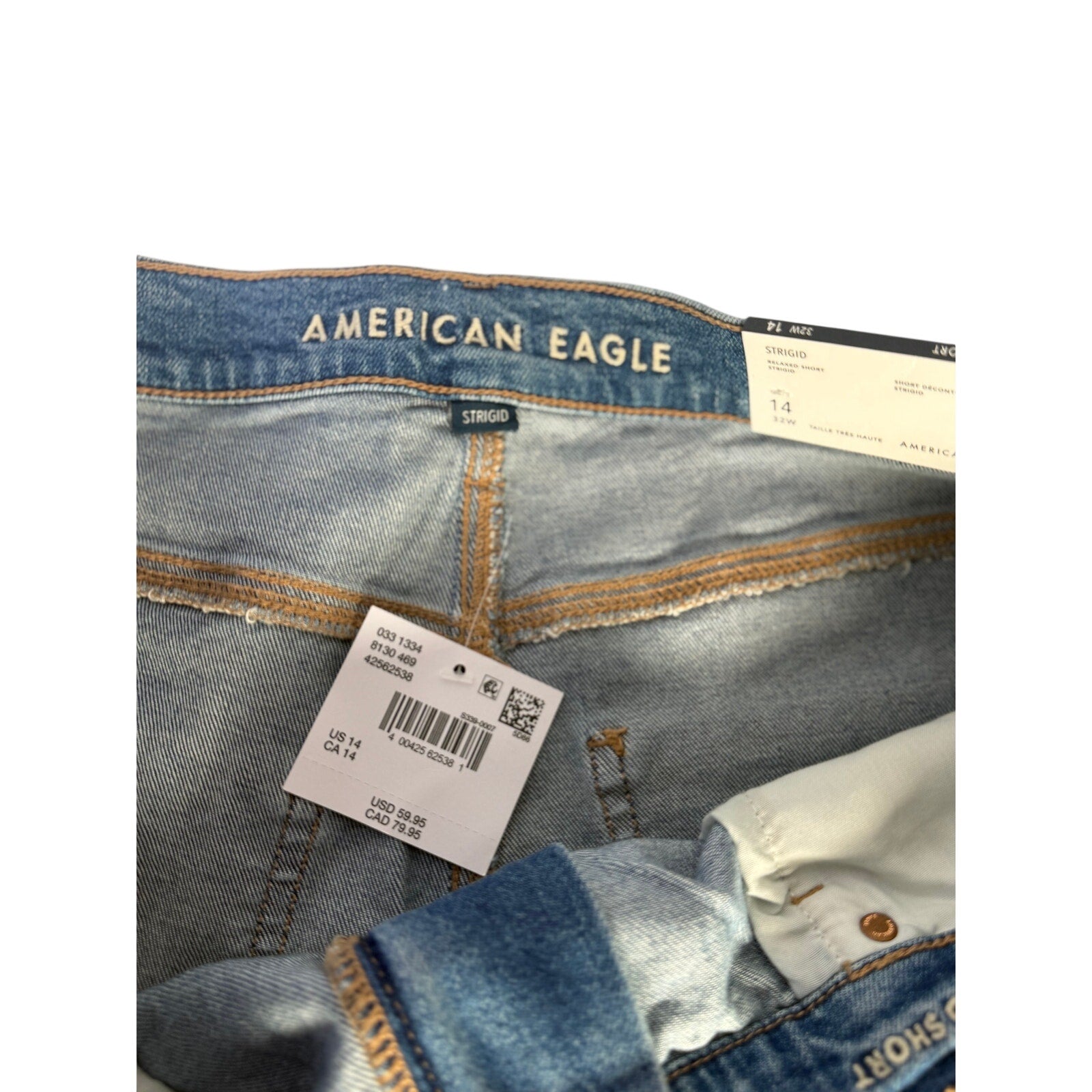 American Eagle women's distressed high-rise denim shorts in size 14, relaxed fit with frayed edges and casual style.