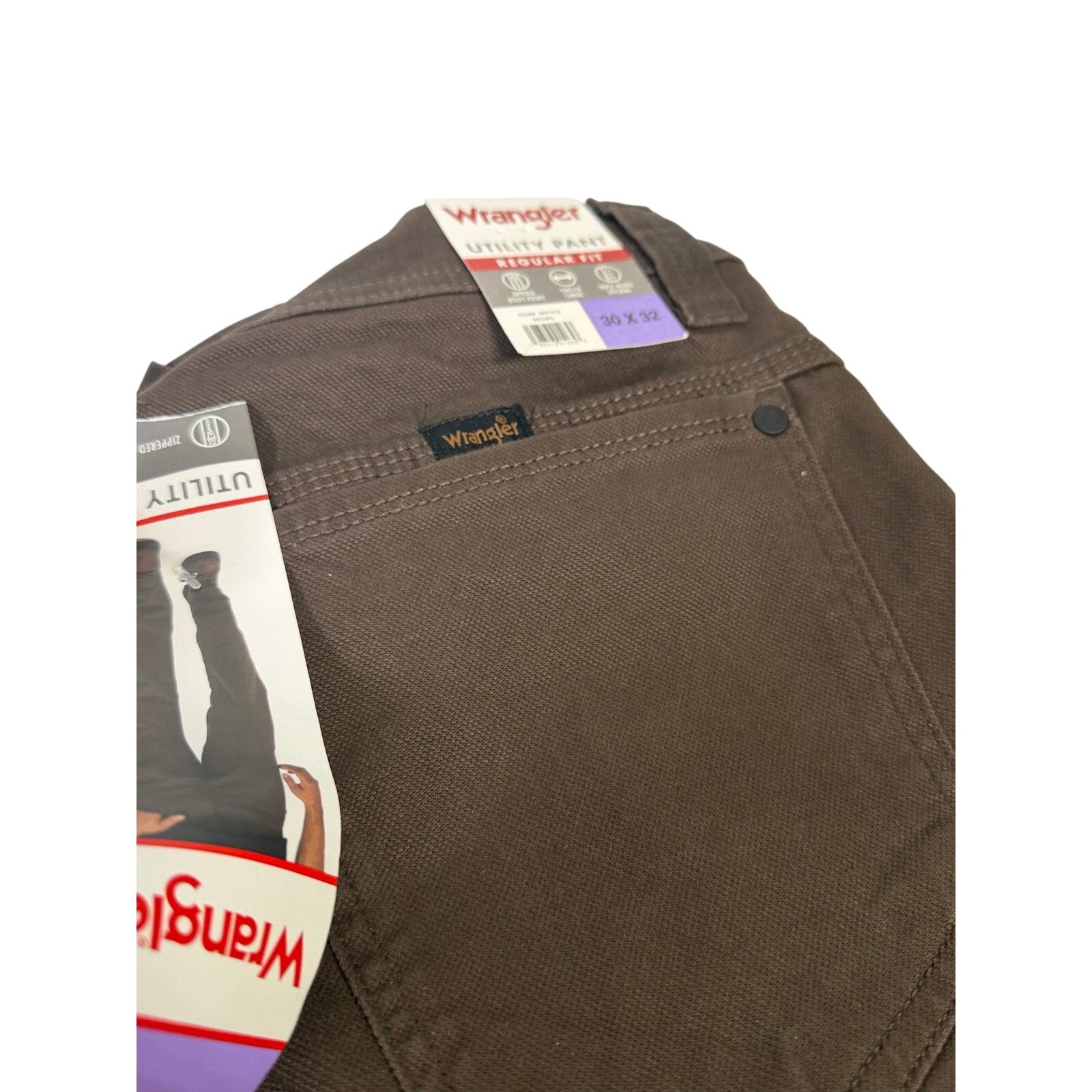Wrangler men's brown utility work pants, size 30x32, durable jeans with multiple pockets and reinforced stitching.