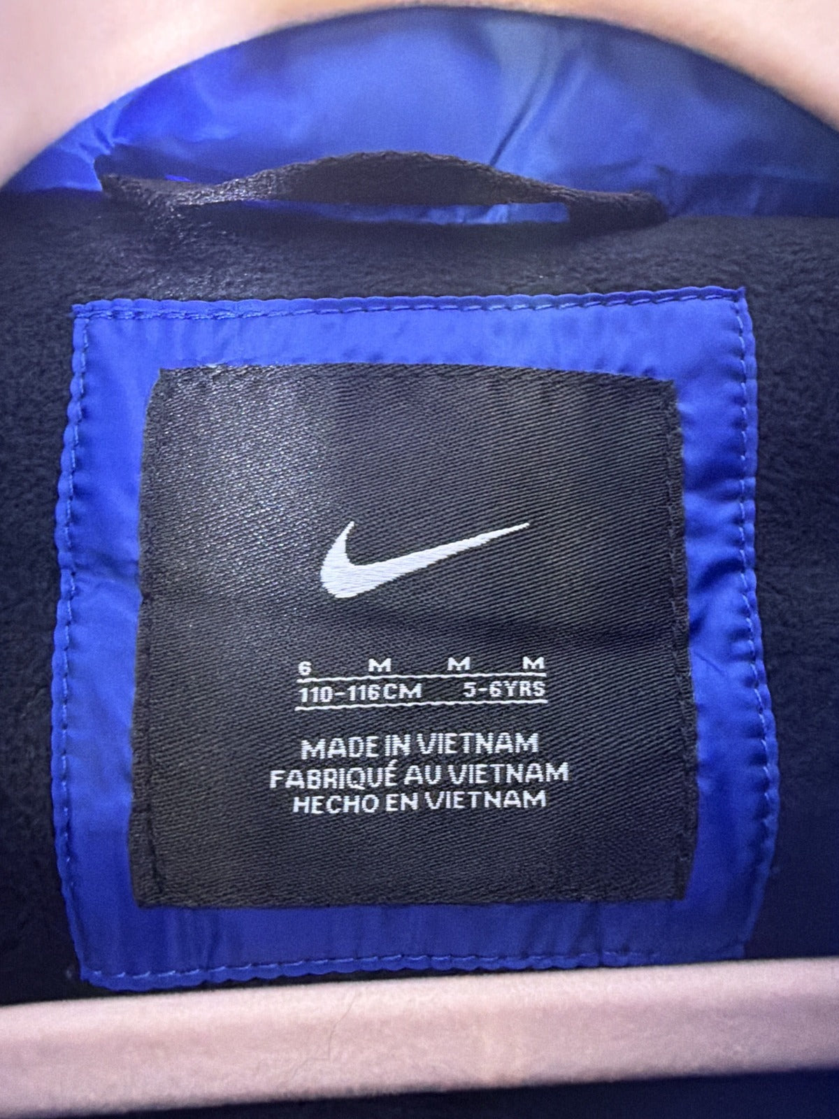Nike little boys' royal blue puffer jacket with full zip and Nike swoosh, size 6, in new condition.