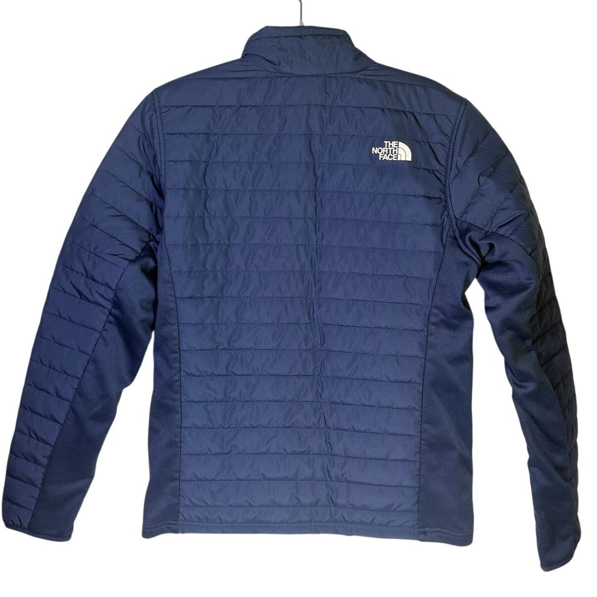 Men's The North Face Canyonlands Hybrid Jacket in summit navy, size small, displayed on a hanger, showcasing the jacket's details.