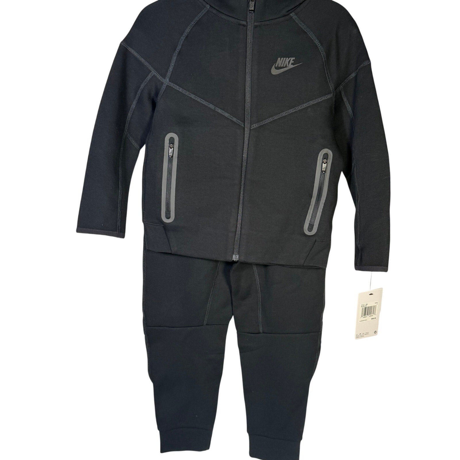 Nike Kids Tech Fleece full-zip hoodie and jogger set in black, size 7, featuring comfortable fleece fabric and sporty design.