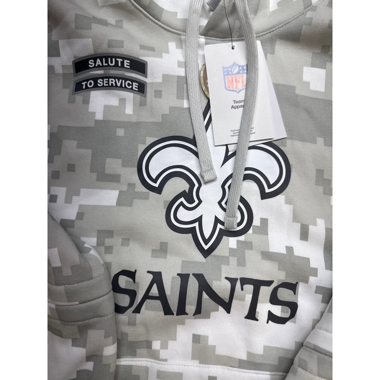 Nike NFL New Orleans Saints gray digital camo hoodie featuring team logo and "Salute to Service" design.