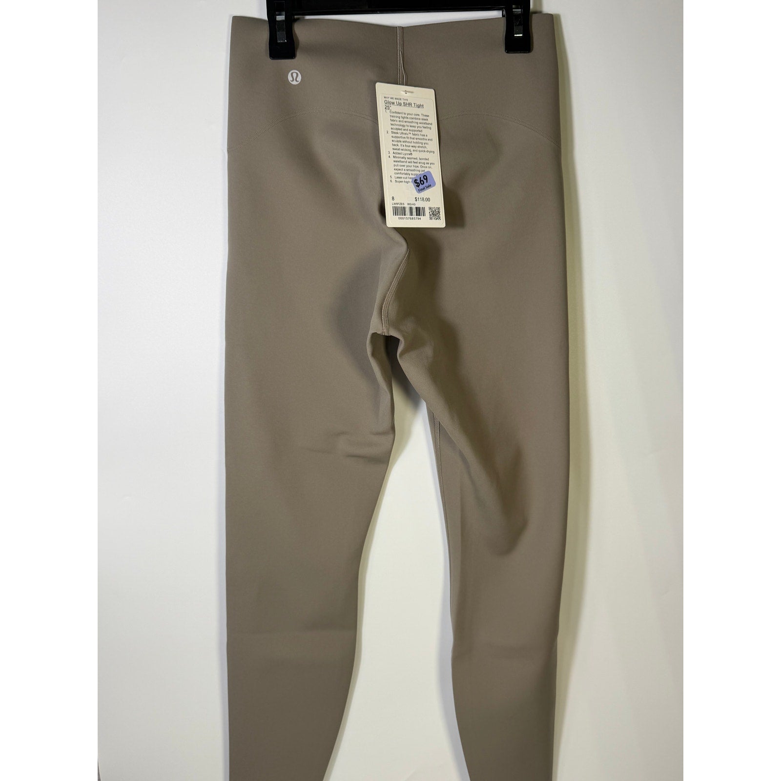 Lululemon Glow Up super-high-rise 25-inch taupe gray leggings in size 8, new with tags, showing fitted waist and smooth fabric.