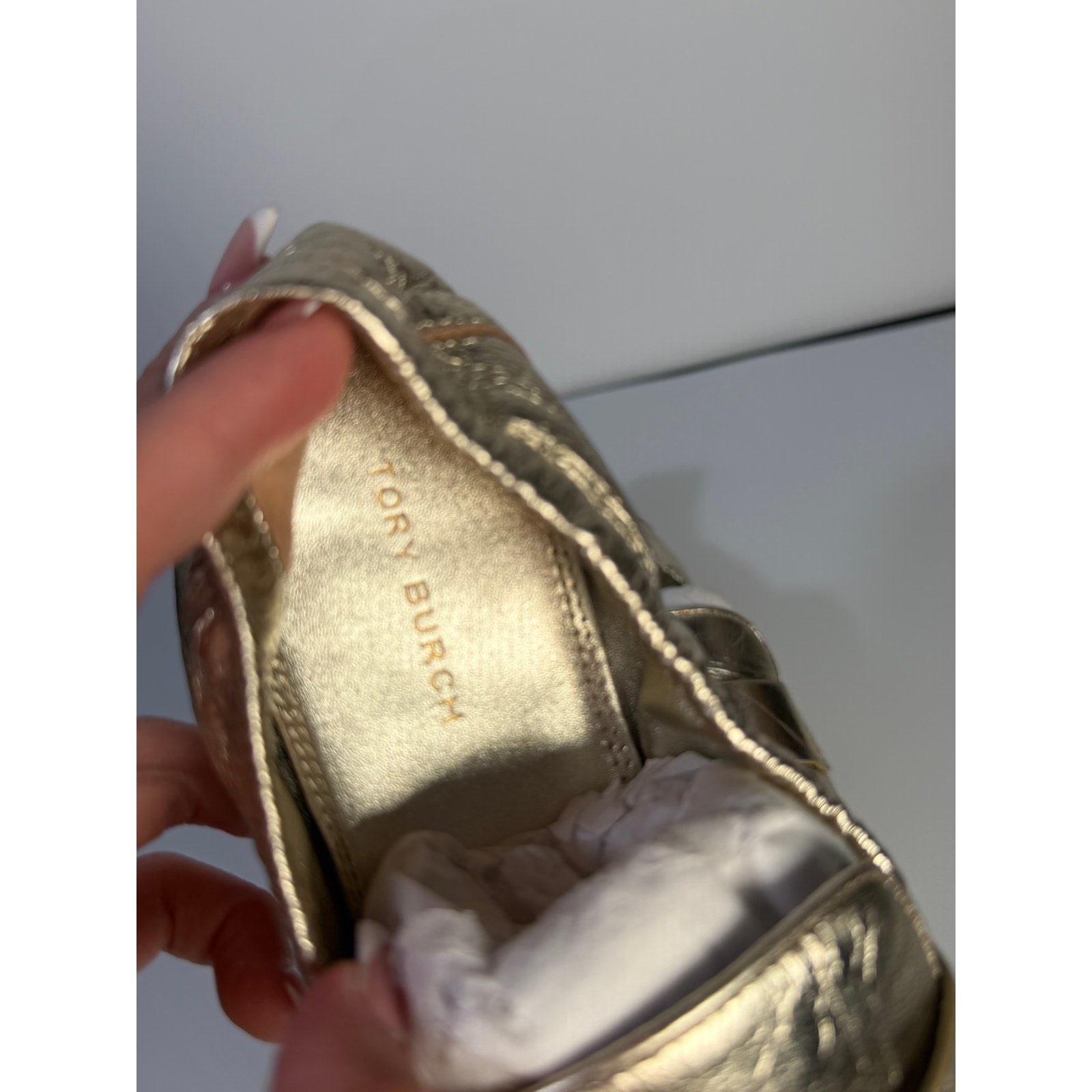 Tory Burch women's gold metallic leather loafers, slip-on flats, size 5M, with sleek design and classic style.