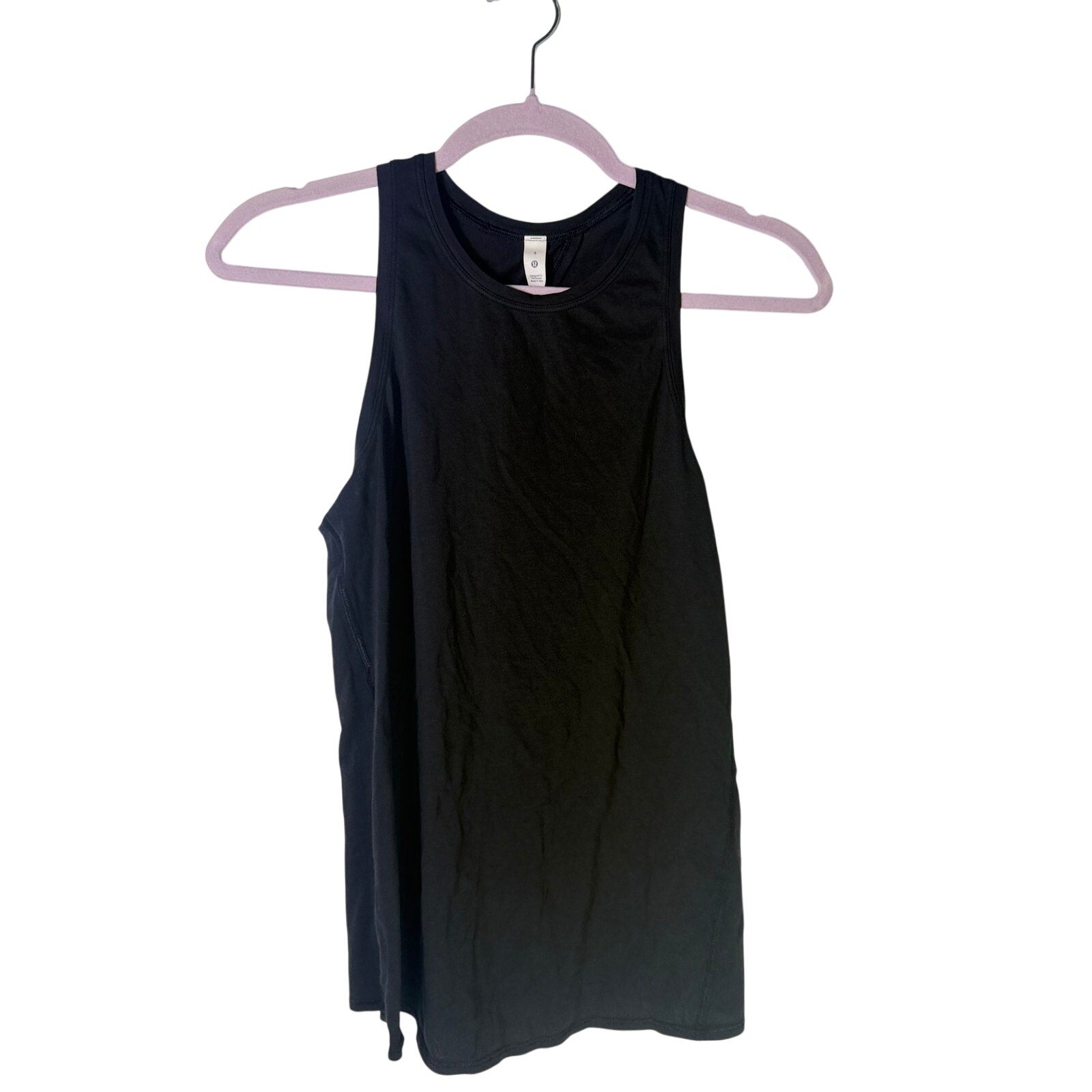 Lululemon women's black high-neck open-back athletic tank top, size 4, shown on a model with a fitted silhouette and athletic design.