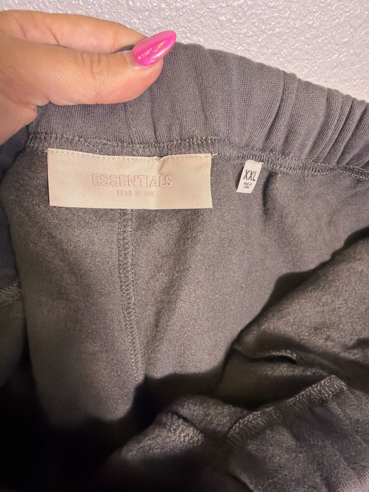 Fear of God Essentials 1977 Sweatpants in iron color, size XXL, showing relaxed fit and soft fabric details.