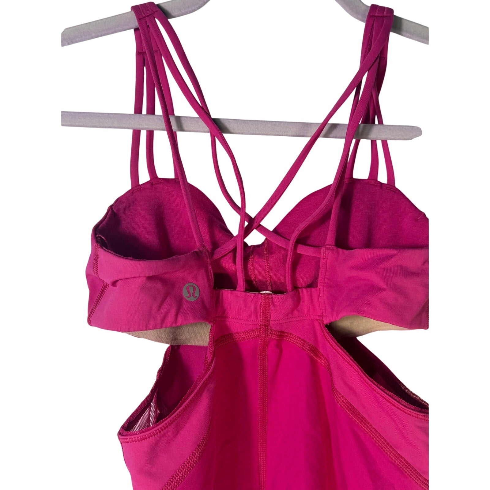 Lululemon women's magenta strappy cutout athletic tank top, size 2, pre-owned, featuring a fitted design and breathable fabric.