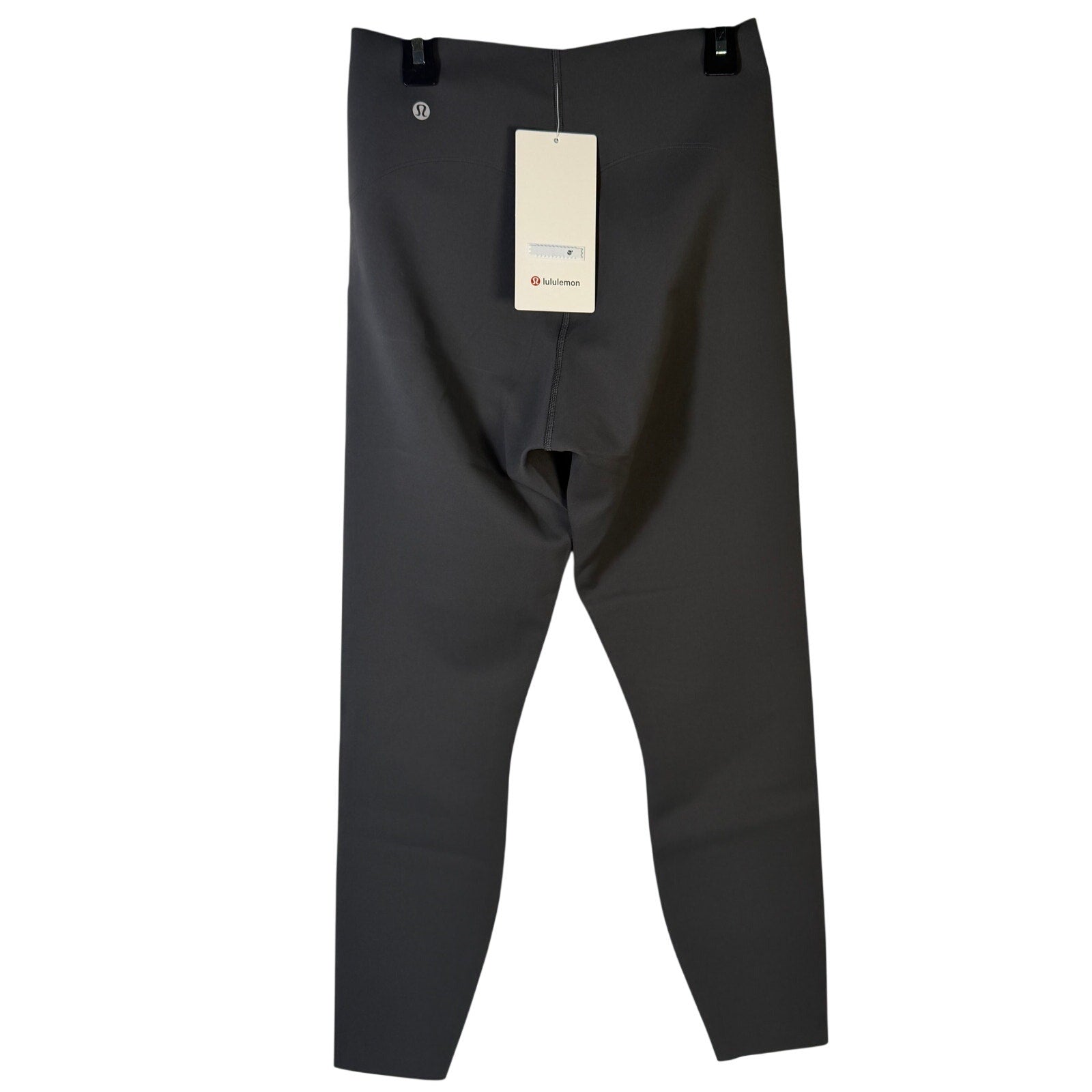 Lululemon Glow Up high-rise leggings in graphite grey, size 8, showcasing the fitted, high-waist design and smooth fabric.