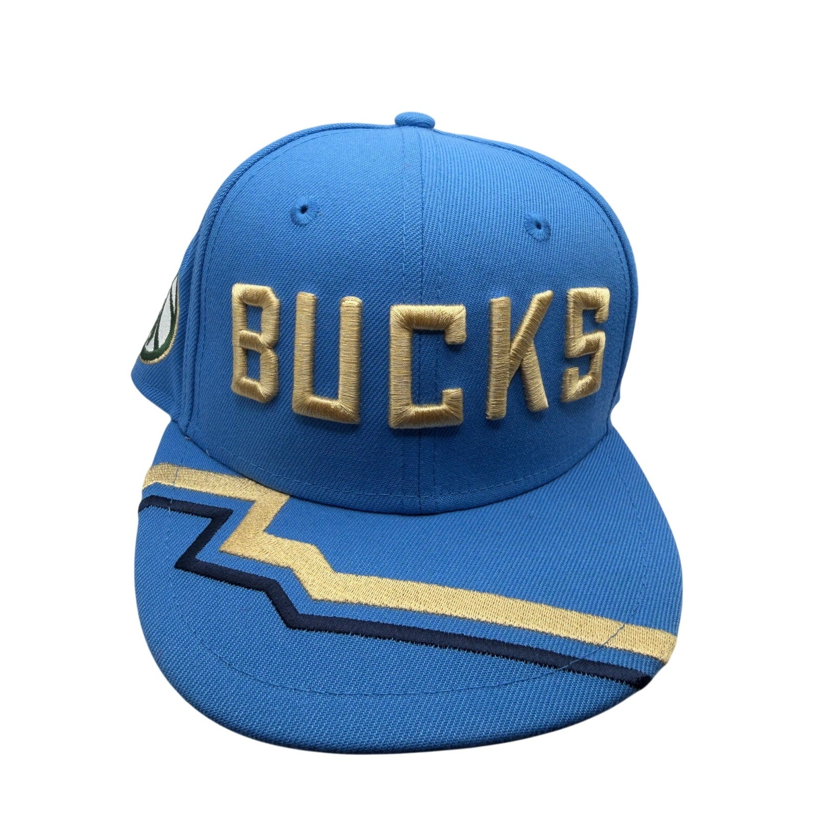 Milwaukee Bucks NBA New Era 9FIFTY snapback hat in blue and gold, featuring team logo and adjustable fit.