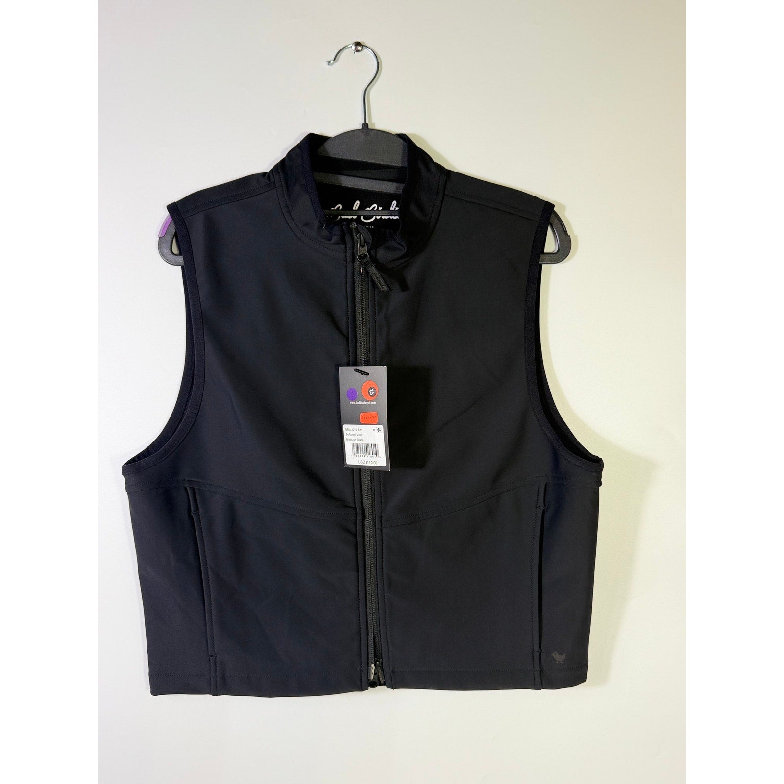 Black Bad Birdie men's softshell golf vest with full zip, front pockets, and sleek design, size medium.