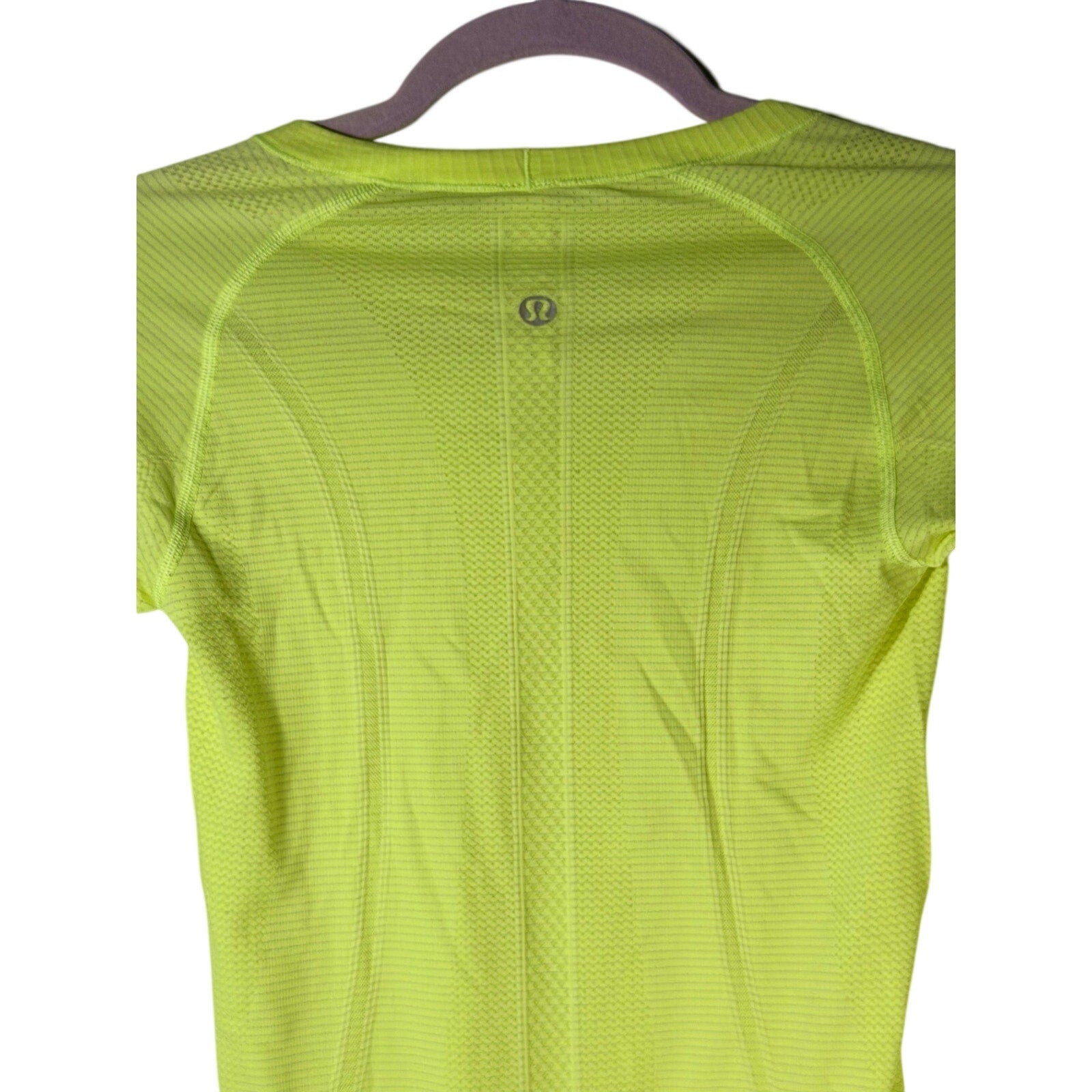 Lululemon Swiftly Tech long sleeve shirt for women, size 4, in a lightweight, breathable fabric, shown on a hanger.
