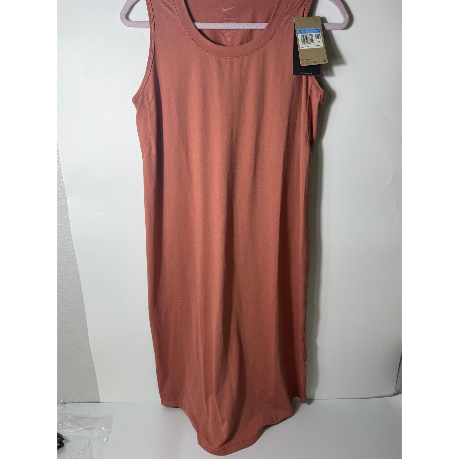 Nike Dri-FIT maternity sleeveless midi dress for women in pink, medium size, featuring a comfortable and stylish design.