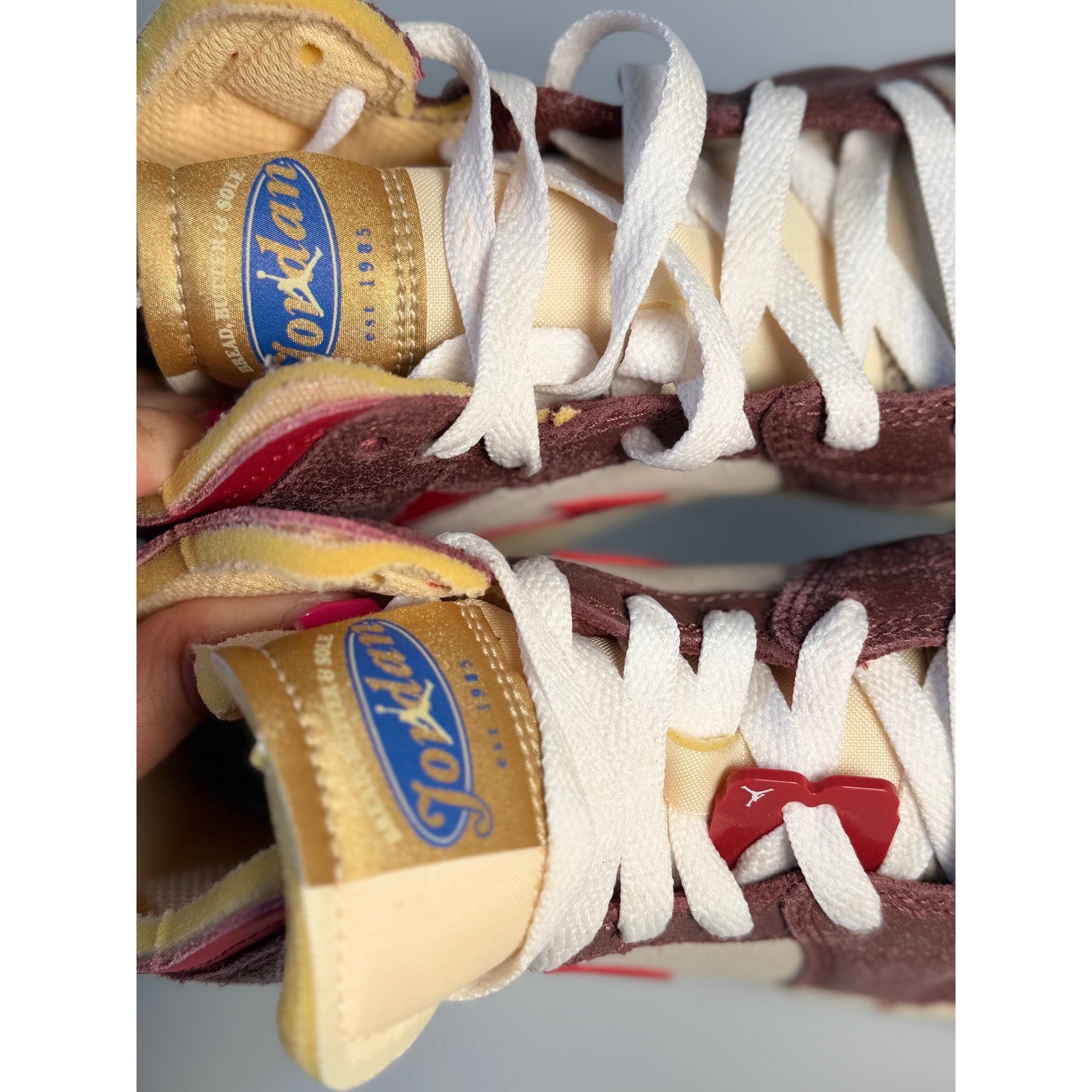 Nike Air Jordan 1 Mid SE Craft sneakers in Sail, Red, and Brown for men, showing the stylish high-top design and premium materials.