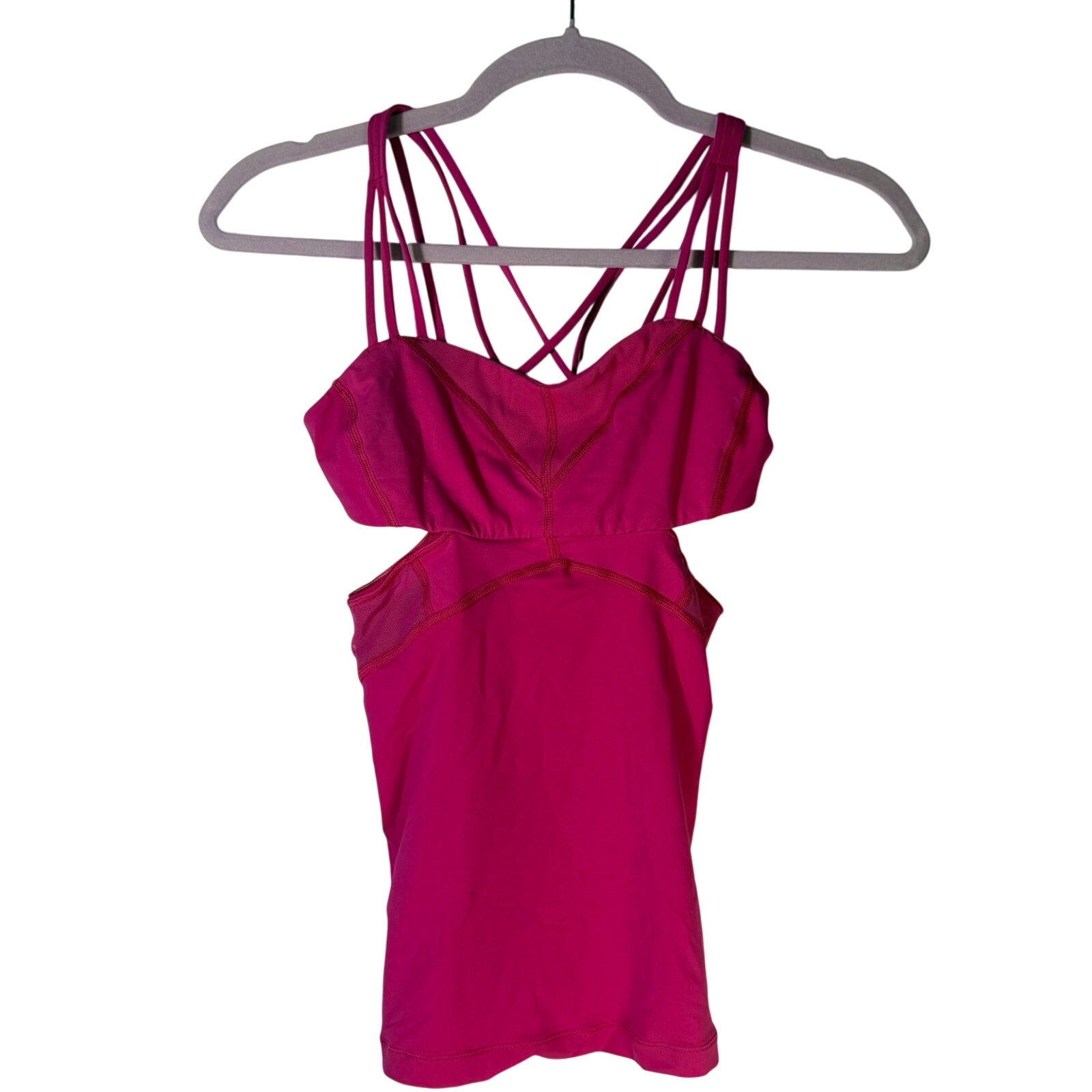 Lululemon women's magenta strappy cutout athletic tank top, size 2, pre-owned, with sleek design and breathable fabric.