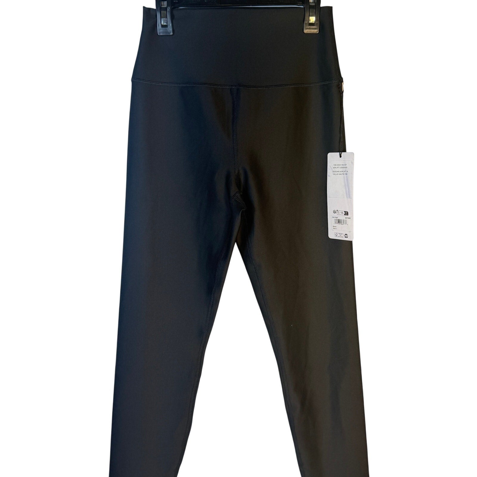 Black Alo Yoga Airlift 7/8 high waist leggings for women, showing the fitted design and sleek stretch fabric.