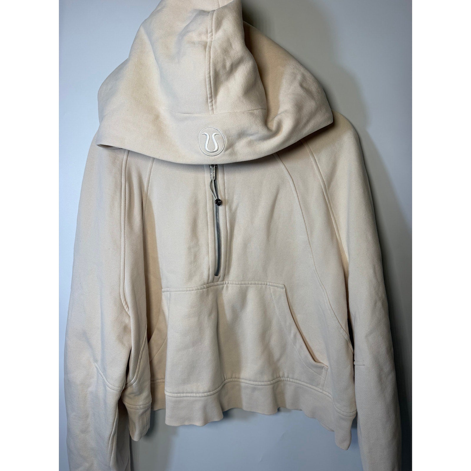 Cream Lululemon Scuba Half Zip Hoodie for women, oversized pullover with relaxed fit, shown in size XL/XXL on model.