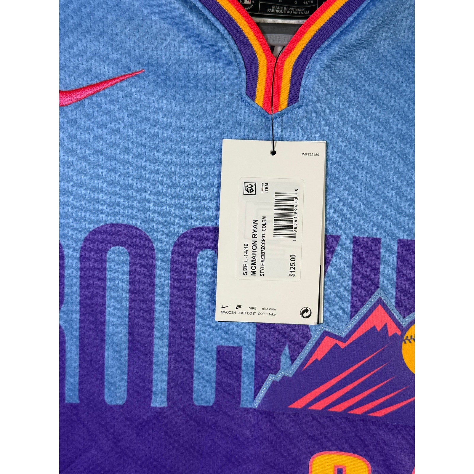 Nike Rockies McMahon #24 City Connect youth jersey in size L 14/16, displayed flat with team and branding details visible.