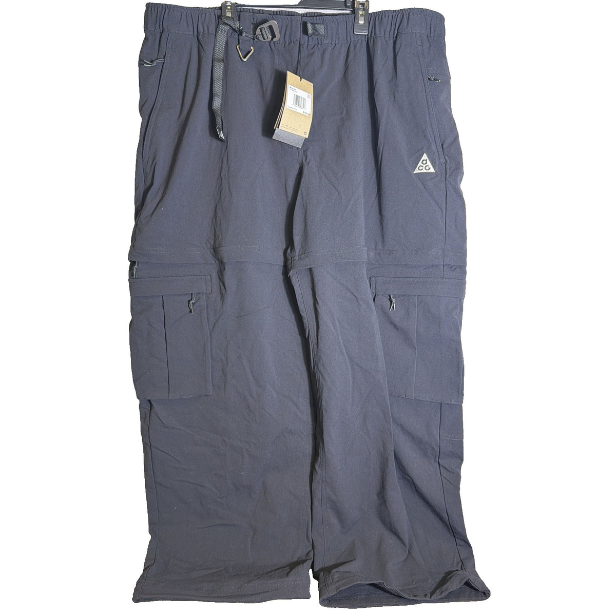 Nike ACG women's convertible zip-off cargo hiking pants in black, size XXL, featuring multiple pockets and adjustable design.